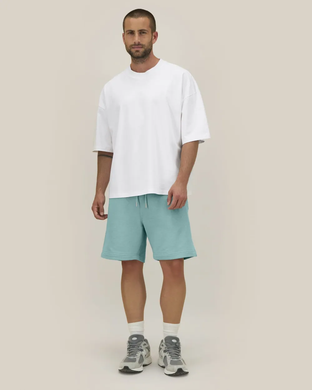 Pantaloni scurți Trainer 2.0 Stanley/Stella — culoarea Verde turcoaz, purtat de model, față